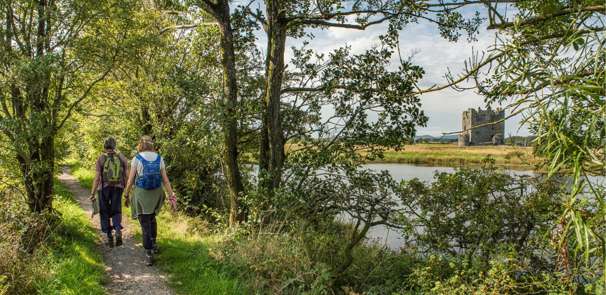 Path beside River Dee with Threave Castle in the background