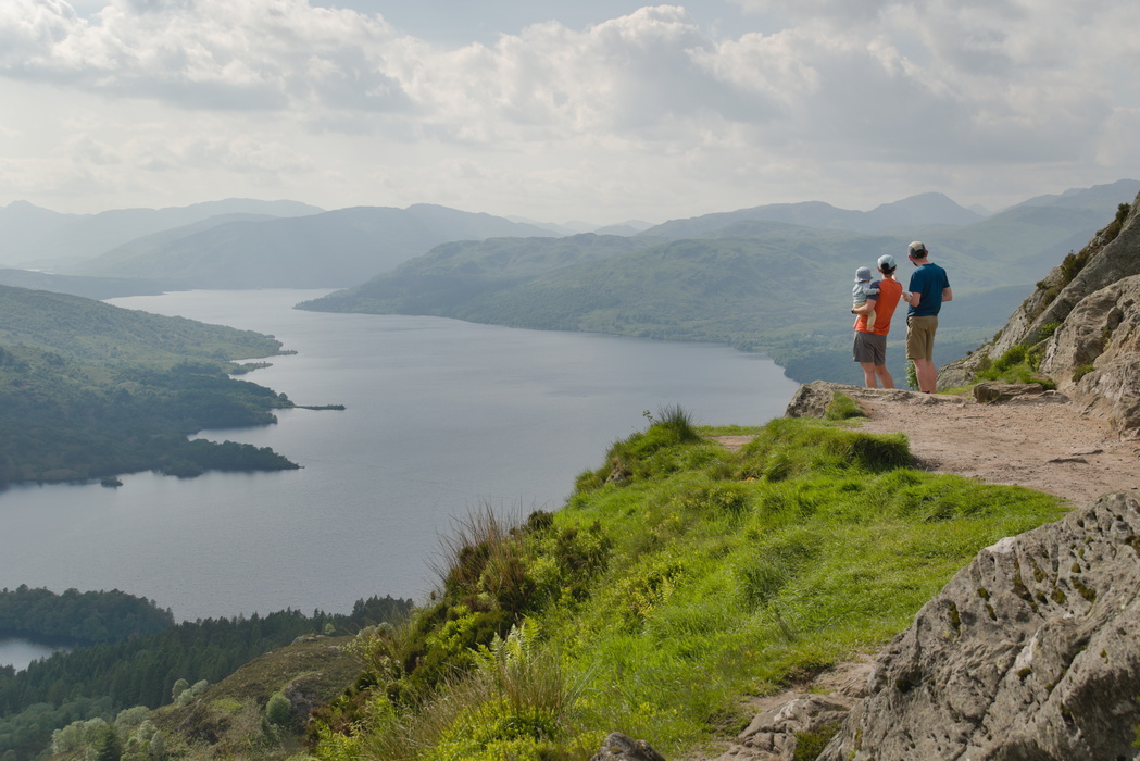 A family enjoying the view from the summit of Ben A’an