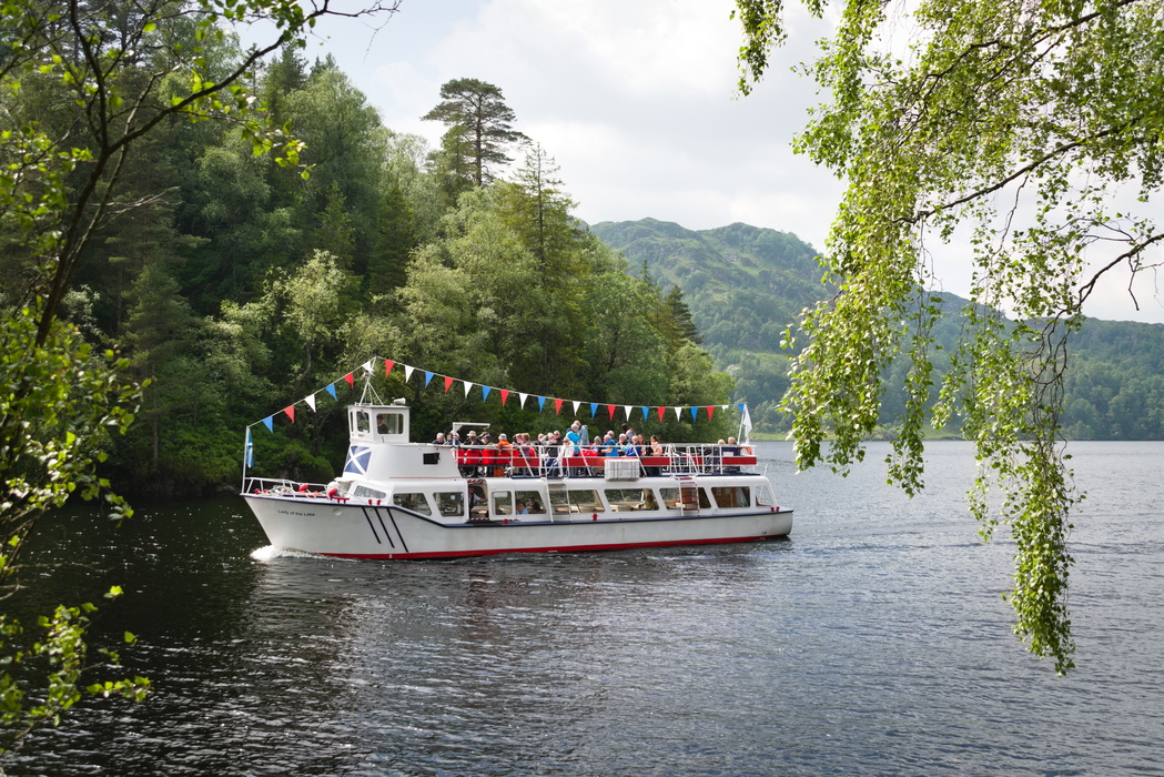 ​​​​​​​Visitors enjoying a boat trip on Loch Katrine