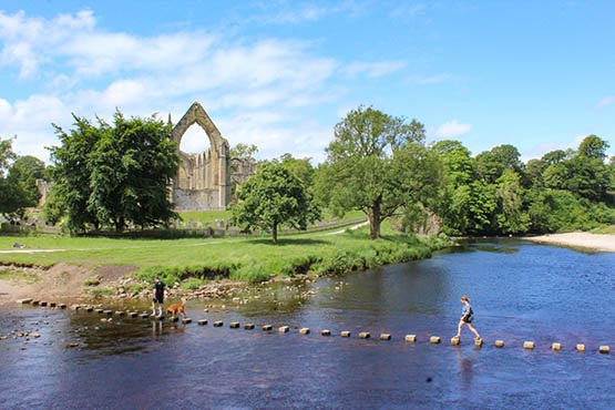 Crossing the stepping stones at Bolton Priory