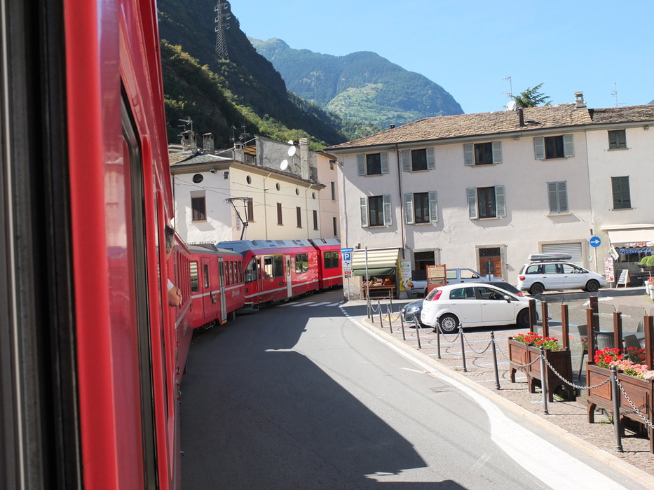 The Bernina Express threads its way between houses at Tirano
