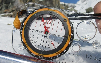 TH Using a built in clinometer a trekking pole helps provide a straight edge on which to measure the slope angle