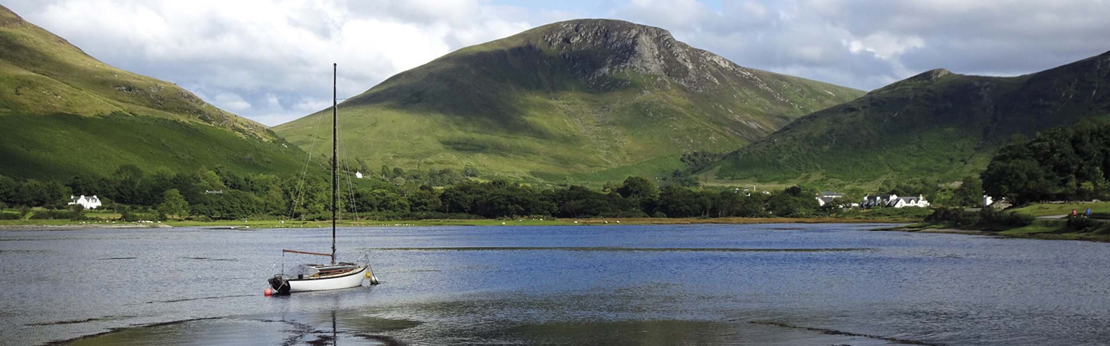 The view inland at high water from Lochranza Castle across the sea loch at Lochranza, Isle of Arran