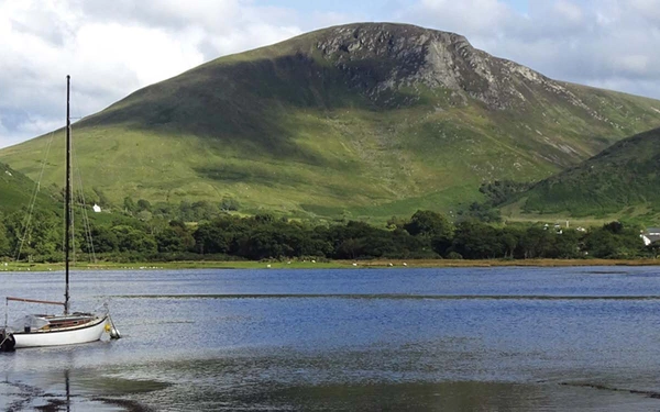 The view inland at high water from Lochranza Castle across the sea loch at Lochranza, Isle of Arran